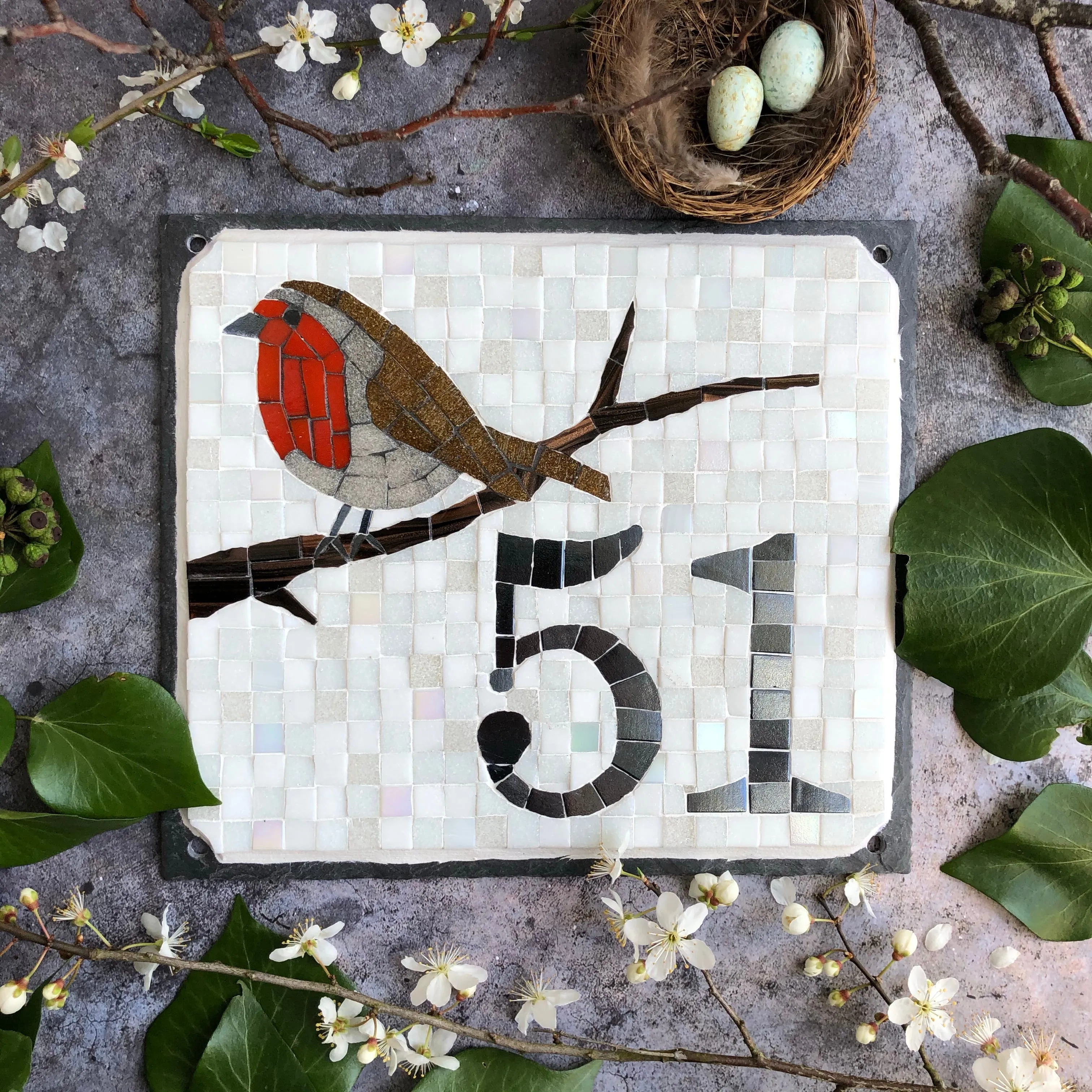 Mosaic house number with a robin