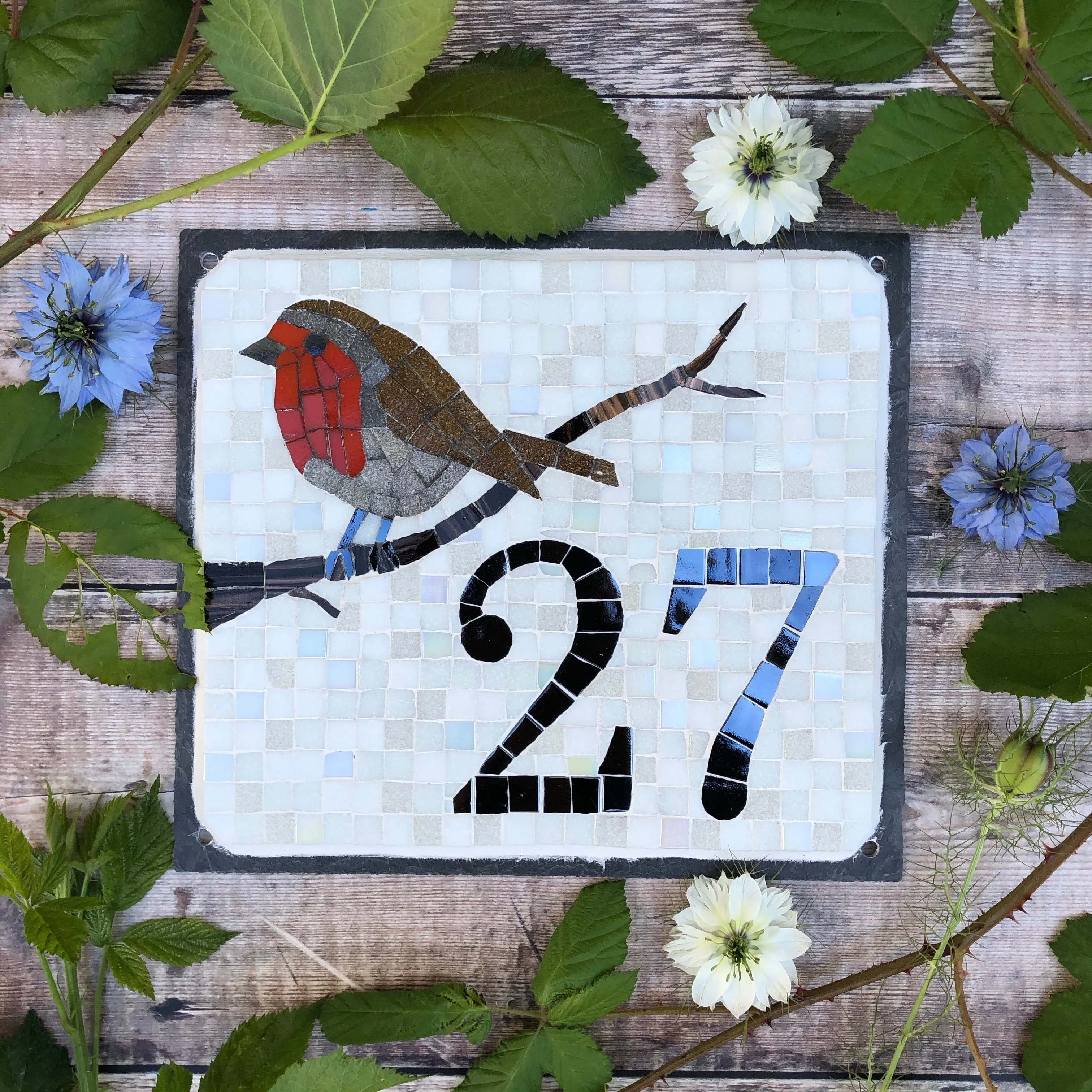 Mosaic house number with a robin