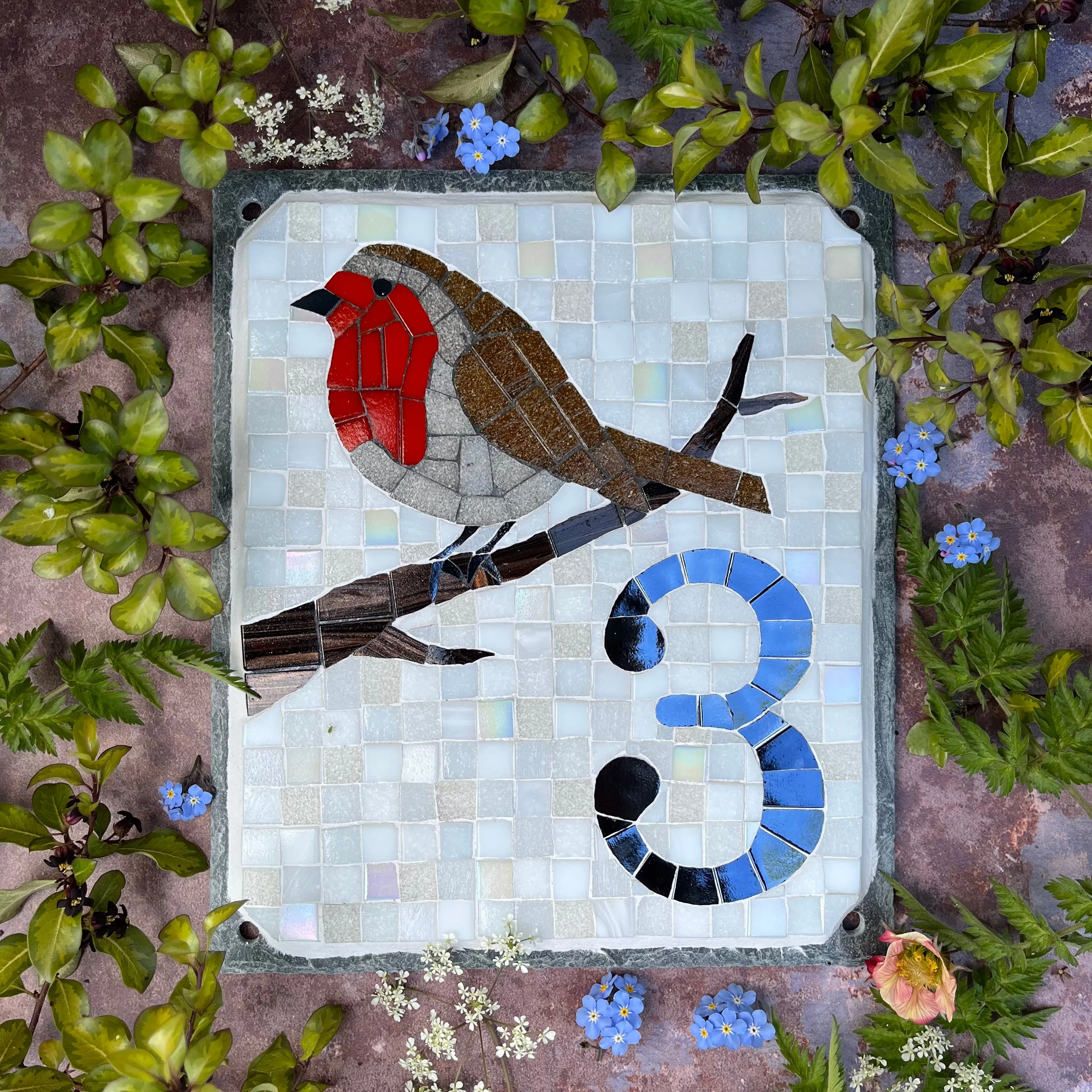 Mosaic house number with a robin